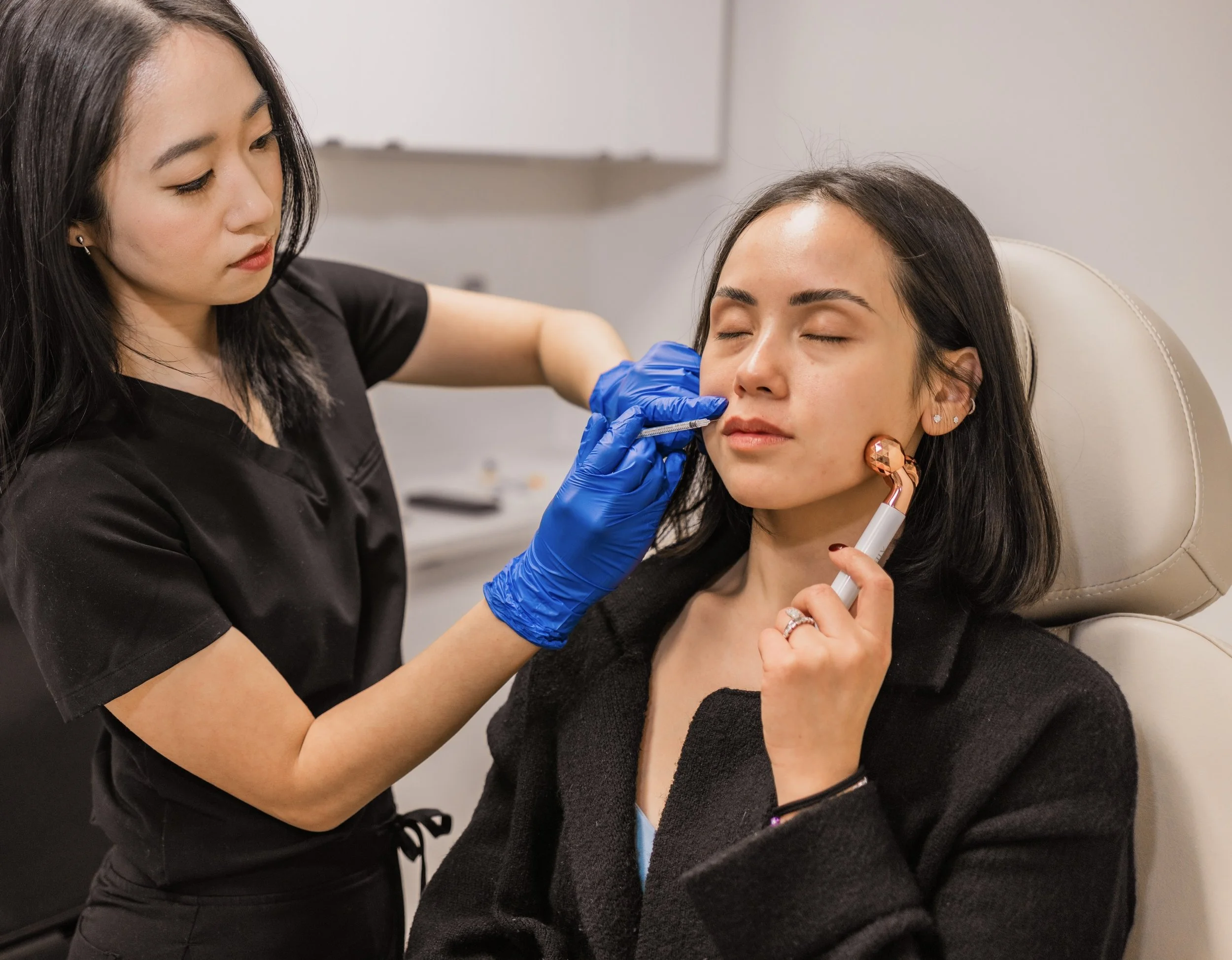 Aesthetic injector administering a facial injectable treatment to a client at Pure Seoul Aesthetics in West Bloomfield, Michigan.